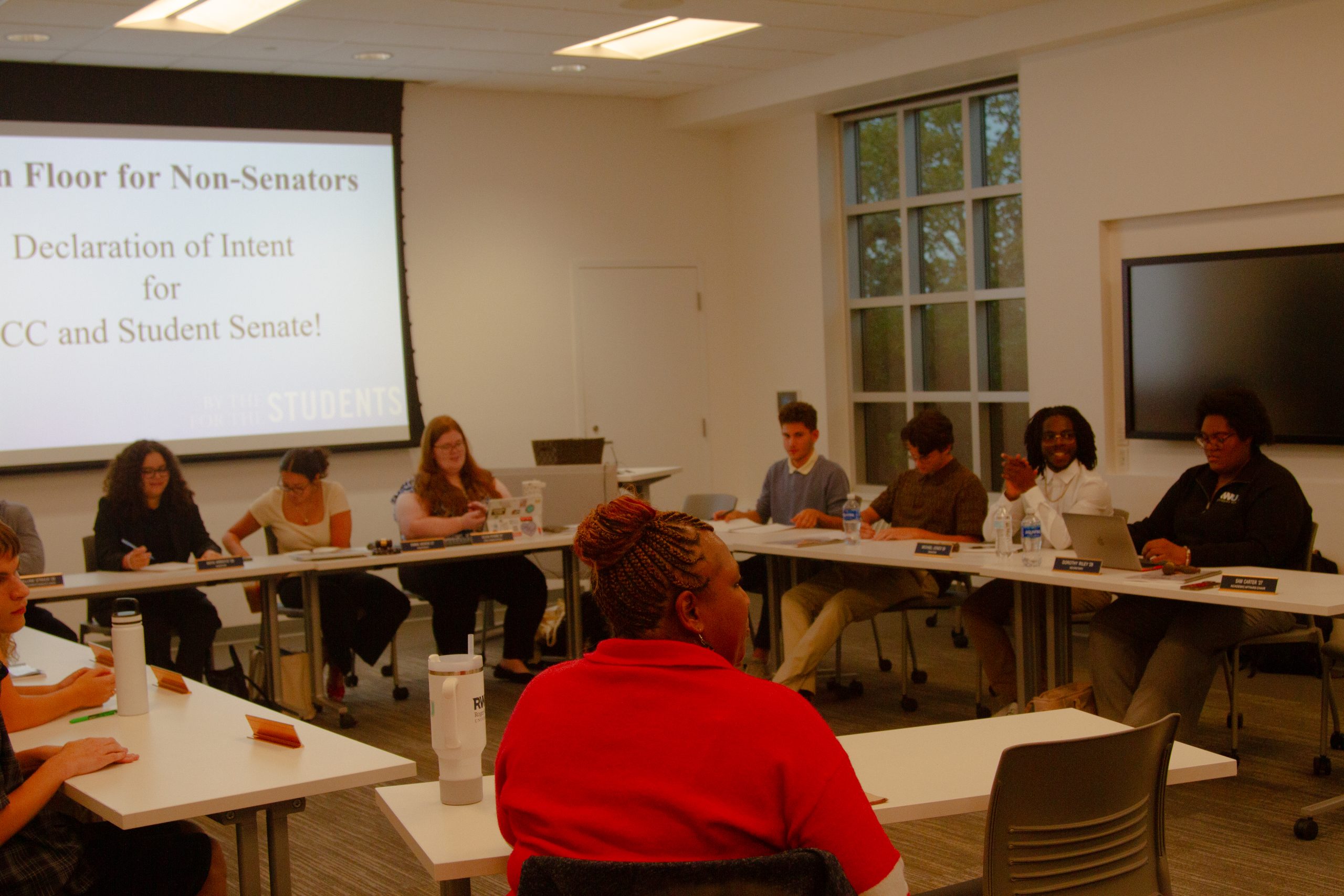 IMG_3529 RWU Senators sitting together discussing issues in a U shape.
